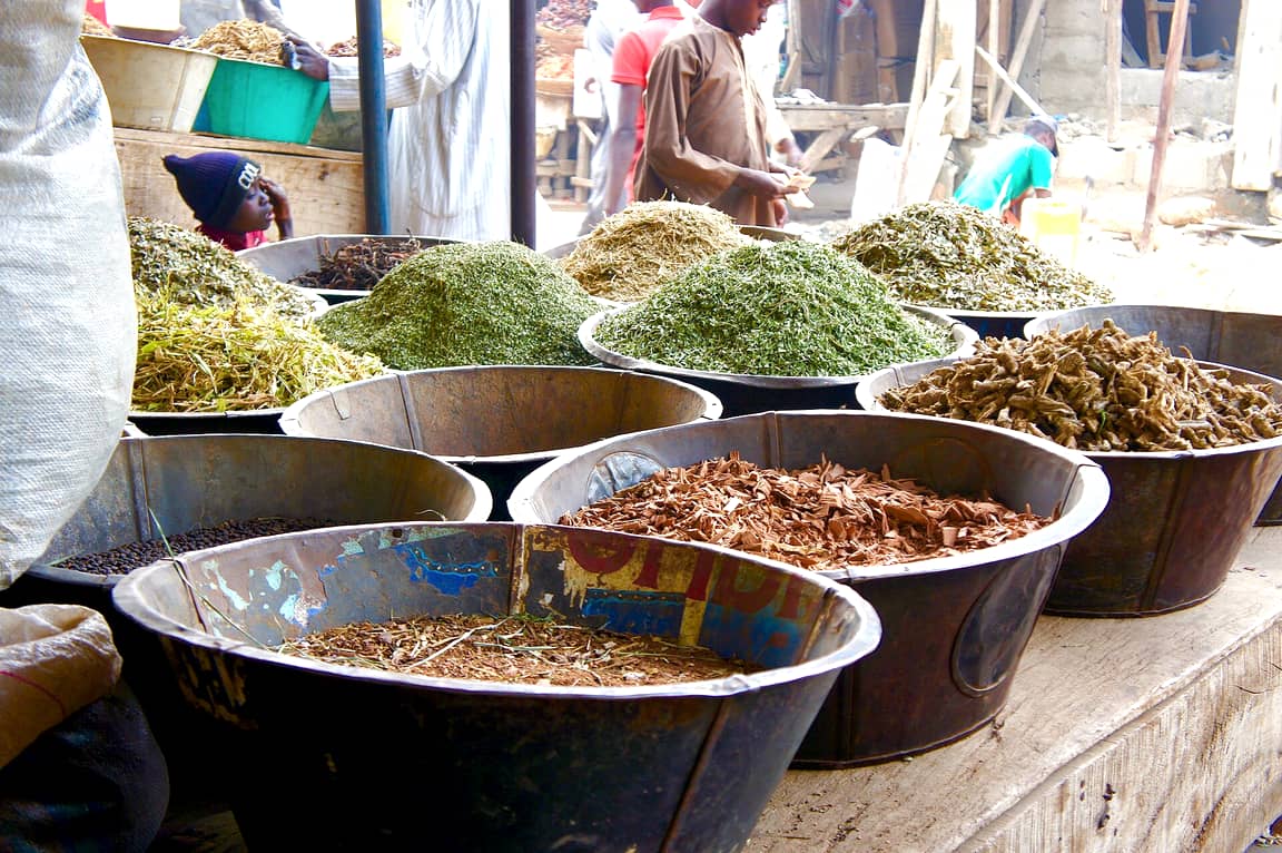 Bowls of sandalwood and incense materials on a stall at Kurmi Market, Kano, Nigeria