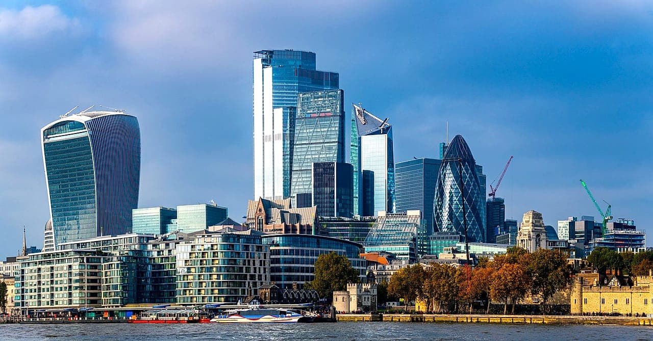 The City of London skyline above the Thames, with the Tower of London in the foreground